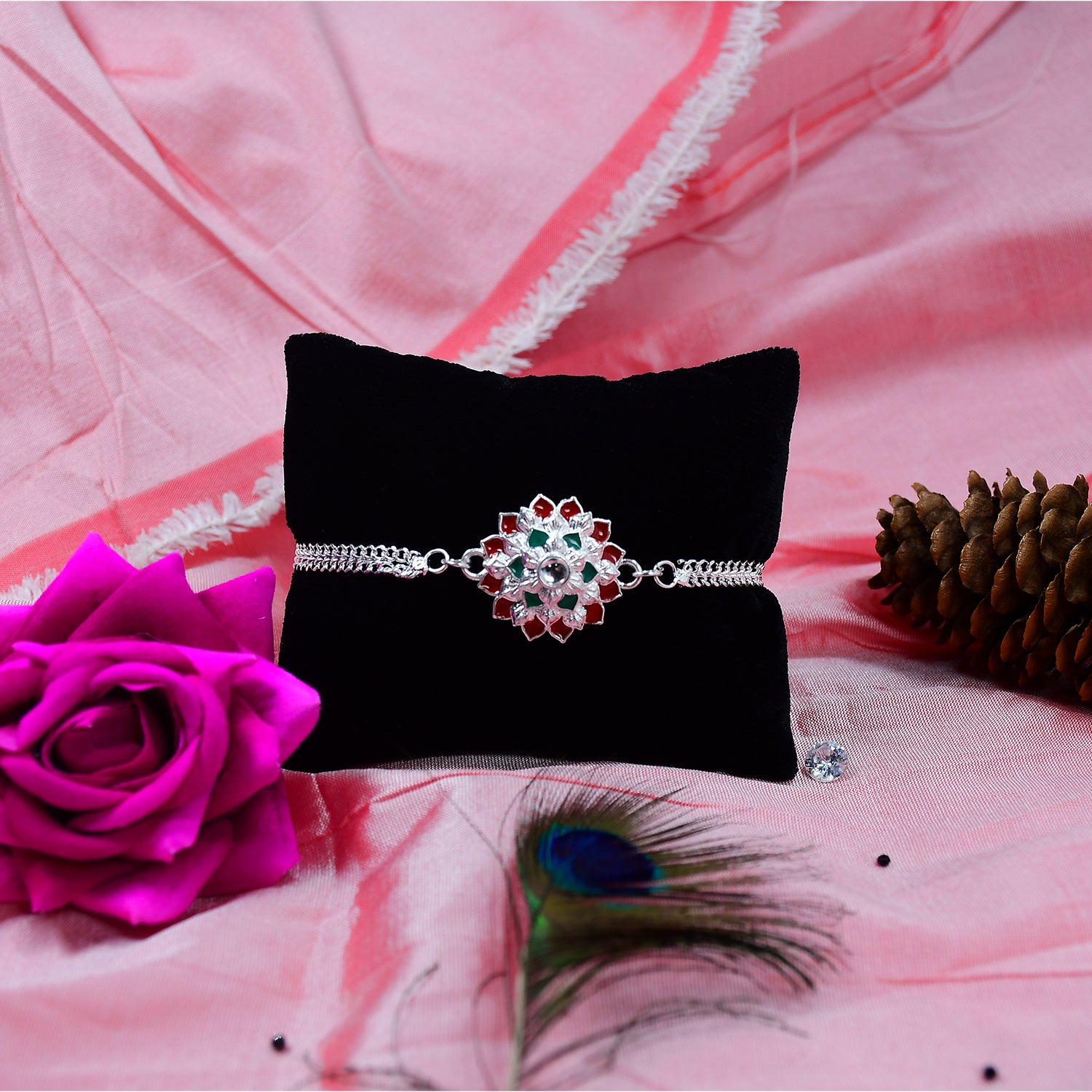 Traditional Floral Rakhi With Red  Green Stones  Silver Designer Rakhi For Brother Traditional Floral Rakhi With Red  Green Stones  Silver Designer Rakhi For Brother